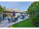 A cozy patio with outdoor seating, an umbrella, and a grill, perfect for entertaining and relaxation at 6232 Crickethollow Dr, Riverview, FL 33578
