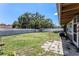 Expansive backyard with green grass and privacy fence, perfect for outdoor activities at 702 Regent S Cir, Brandon, FL 33511
