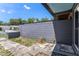 Small backyard space with hardscaping, ready for landscaping or outdoor enjoyment at 702 Regent S Cir, Brandon, FL 33511