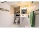 Bathroom with modern toilet, floating sink, and tiled walls at 702 Regent S Cir, Brandon, FL 33511