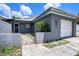 Quaint one-story home with a single-car garage and a gated front yard, offering cozy curb appeal at 702 Regent S Cir, Brandon, FL 33511