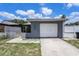 Lovely one-story home featuring a single-car garage, a gated front yard, and a neatly maintained exterior at 702 Regent S Cir, Brandon, FL 33511