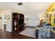 Open living room with wood floors, an entertainment center, and plenty of space for Gathering gatherings at 702 Regent S Cir, Brandon, FL 33511