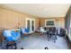 Enclosed patio with a grill and seating, great for enjoying outdoor meals at 702 Regent S Cir, Brandon, FL 33511