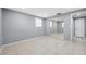 This bedroom includes tile flooring and a closet with mirrored sliding doors at 7123 Cherry Laurel Dr, Port Richey, FL 34668