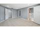 Bedroom with tile flooring, ensuite bathroom, and ample closet space at 7123 Cherry Laurel Dr, Port Richey, FL 34668