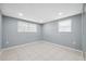 This bedroom features tile flooring and two windows that allow ample natural light at 7123 Cherry Laurel Dr, Port Richey, FL 34668