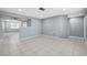 Open-concept dining area with neutral walls, tile floors, and an airy layout, perfect for Gathering gatherings at 7123 Cherry Laurel Dr, Port Richey, FL 34668