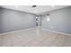 Spacious dining room featuring neutral walls, tile floors, and an open layout for entertaining at 7123 Cherry Laurel Dr, Port Richey, FL 34668
