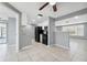 Well-designed kitchen with black appliances, bright cabinetry, and tile floors for easy maintenance at 7123 Cherry Laurel Dr, Port Richey, FL 34668