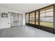 Enclosed porch with access to the backyard and interior at 7123 Cherry Laurel Dr, Port Richey, FL 34668