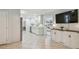 Kitchen with stainless steel appliances and view to the sunroom at 734 Lake Forest Rd, Clearwater, FL 33765