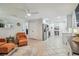 Open living area with tile floors that connects to the kitchen at 734 Lake Forest Rd, Clearwater, FL 33765