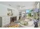 Bright and open living room with access to a sunroom and patio at 734 Lake Forest Rd, Clearwater, FL 33765