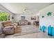 Bright living room featuring tile floors, neutral tones and stylish furnishings at 734 Lake Forest Rd, Clearwater, FL 33765