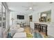 Bright and open living room with views of the sunroom and kitchen at 734 Lake Forest Rd, Clearwater, FL 33765