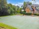 Outdoor basketball court near a house with green space, perfect for recreation at 7410 Ambleside Dr, Land O Lakes, FL 34637