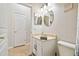 Bathroom featuring a vanity with an oval mirror, toilet, and view of a bedroom at 7410 Ambleside Dr, Land O Lakes, FL 34637