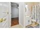 Well-lit bathroom featuring a vanity with marble countertop, toilet, and shower with curtain at 7410 Ambleside Dr, Land O Lakes, FL 34637