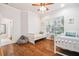 Bedroom with wood floors, natural lighting and two twin beds at 7410 Ambleside Dr, Land O Lakes, FL 34637