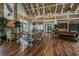 Spacious community center with dining tables, cozy seating, fireplace, and an inviting atmosphere for gatherings at 7410 Ambleside Dr, Land O Lakes, FL 34637