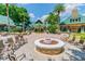 Inviting courtyard with a fire pit, seating, and beautiful landscaping creating a peaceful retreat at 7410 Ambleside Dr, Land O Lakes, FL 34637