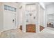 Inviting entryway featuring an elegant chandelier and a view into the adjacent dining area at 7410 Ambleside Dr, Land O Lakes, FL 34637