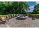 Picturesque community fire pit with comfortable seating, ideal for socializing and enjoying outdoors at 7410 Ambleside Dr, Land O Lakes, FL 34637
