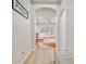 Hallway leading to a bright living room at 7410 Ambleside Dr, Land O Lakes, FL 34637