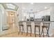 Bright kitchen features white cabinets, granite counters, stainless steel appliances, and a breakfast bar at 7410 Ambleside Dr, Land O Lakes, FL 34637