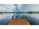 Private lake access from dock with ladder, promising serene waterfront living at 7410 Ambleside Dr, Land O Lakes, FL 34637