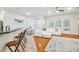 Spacious living room with a white sofa, fireplace, and wood floors at 7410 Ambleside Dr, Land O Lakes, FL 34637