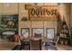 Inviting lobby area with nature-themed decor, murals, and seating for relaxation at 7410 Ambleside Dr, Land O Lakes, FL 34637