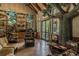 Cozy nature center interior with seating, nature displays, and a tree decoration for a unique experience at 7410 Ambleside Dr, Land O Lakes, FL 34637