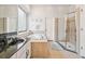 Bright bathroom features a soaking tub, a stand-up shower, and tile floors at 7410 Ambleside Dr, Land O Lakes, FL 34637