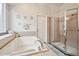 Bright bathroom features a soaking tub and a stand-up shower at 7410 Ambleside Dr, Land O Lakes, FL 34637