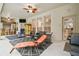 The screened patio features multiple seating areas, a tiki bar, an outdoor grill, and lots of light from large windows at 7410 Ambleside Dr, Land O Lakes, FL 34637