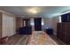 Cozy bedroom with wood-look flooring, dresser, and plenty of natural light at 7415 San Moritz Dr, Port Richey, FL 34668