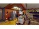 Rustic kitchen with stone fireplace, stainless steel appliances, and a unique backsplash at 7415 San Moritz Dr, Port Richey, FL 34668