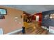 View of living area and rustic kitchen with a stone fireplace at 7415 San Moritz Dr, Port Richey, FL 34668