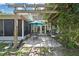 The backyard has a brick patio with a wooden pergola at 7924 Singing Court Pl, Tampa, FL 33615