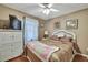 Cozy bedroom featuring a wicker bed frame, neutral tones, and ample space at 7924 Singing Court Pl, Tampa, FL 33615