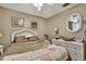 Cozy bedroom with white wicker furniture and neutral decor at 7924 Singing Court Pl, Tampa, FL 33615