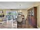 Dining area with hardwood floors, elegant table, and a hutch at 7924 Singing Court Pl, Tampa, FL 33615