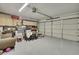 Spacious garage with ample storage cabinets, painted flooring, and large sectional doors at 7924 Singing Court Pl, Tampa, FL 33615
