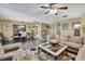 Open-concept living room with dining area and comfortable seating at 7924 Singing Court Pl, Tampa, FL 33615