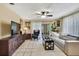 Bright living room with tile flooring, sofa, and access to the backyard at 7924 Singing Court Pl, Tampa, FL 33615