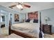 Bright primary bedroom features a four-poster bed, soft lighting, and ample space at 7924 Singing Court Pl, Tampa, FL 33615