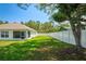 Spacious backyard features a privacy fence and mature trees at 8508 Bay Dr, Spring Hill, FL 34606