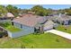 Features a fenced-in yard with fresh landscaping, two-car garage, and a well-manicured lawn at 8508 Bay Dr, Spring Hill, FL 34606